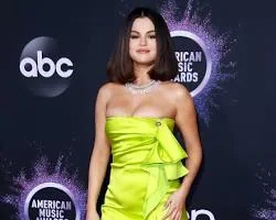 Selena Gomez in a lime green Versace mini dress at the 2019 American Music Awards
