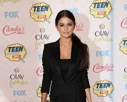 Selena Gomez in a black Saint Laurent jumpsuit at the 2022 Grammy Awards